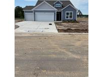 Charming single-Gathering home with a two-car garage and well-maintained landscaping at 180 Glengrove Lane, Murrells Inlet, SC 29576