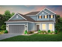 Charming two-story home showcasing a light blue exterior, well-manicured lawn, and an attached two-car garage at 291 River Edge Dr., Myrtle Beach, SC 29588