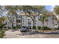 Attractive three story condo building with covered entry, landscaping, and reserved parking at 351 Lake Arrowhead Rd. # 131, Myrtle Beach, SC 29572