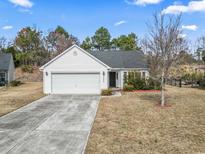 Charming single-story home with a well-manicured lawn and attached garage at 2288 Beauclair Ct., Myrtle Beach, SC 29579