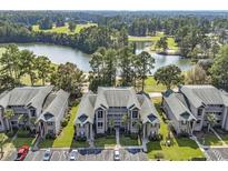 Beautiful condo complex with manicured landscaping, golf course and a large pond in a scenic setting at 298 Pinehurst Ln. # 10-J, Pawleys Island, SC 29585