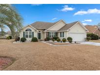 Charming one-story home features manicured landscaping and a well-maintained lawn at 3986 Lochview Dr., Myrtle Beach, SC 29588