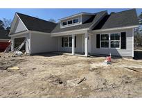 Charming new construction home with light gray siding and classic black shutters at 4020 Copperhead Rd., Conway, SC 29527