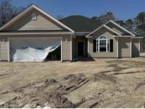 New single-story home with neutral siding, a black roof, covered garage, and unfinished landscaping at 4024 Copperhead Rd., Conway, SC 29527