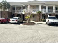 Well-maintained building with balconies and parking at 700 Pickering Dr. # 103, Murrells Inlet, SC 29576