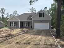 Charming single-story home featuring a two-car garage and stylish architectural details at 8545 Pee Dee Hwy., Conway, SC 29527