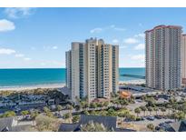 Beautiful beachfront condo building with ocean views and an inviting tropical landscape at 8560 Queensway Blvd. # 2002, Myrtle Beach, SC 29572