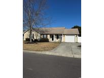 Charming single-story home with a well-maintained lawn, driveway and a one-car garage at 986 Bellflower Dr., Longs, SC 29568