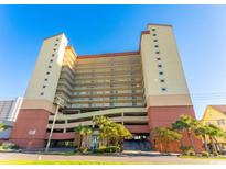 Stunning high-rise condo building with convenient garage parking and beautiful landscaping at 1706 S Ocean Blvd. # 1001, North Myrtle Beach, SC 29582