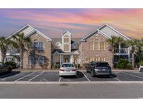 Beautiful condominium complex with brick and siding facade plus front parking at 21 Pistachio Loop # E, Murrells Inlet, SC 29576