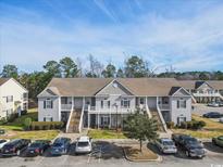 Well maintained condominium complex with ample parking and exterior stairwells to upper level units at 220 Portsmith Dr. # 2, Myrtle Beach, SC 29588