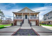 Charming two-story home with a front porch, two car garage and beautifully landscaped yard at 232 Wahee Pl., Conway, SC 29527