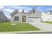 Charming single-Gathering home with manicured lawn and attached two-car garage at 3215 Preciado Dr., Myrtle Beach, SC 29579