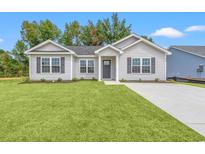 Charming single-story home with a well-manicured lawn and inviting entrance at 346 Barn Owl Way, Conway, SC 29527
