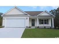 Charming single-story home with white siding, attached garage, and a well-manicured lawn at 350 Barn Owl Way, Conway, SC 29527