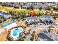 Wonderful community featuring pool, tennis court, and golf course views from this condo complex at 5801 Oyster Catcher Dr. # 121, North Myrtle Beach, SC 29582