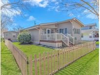 Charming home with a front porch, picket fence, and lush green lawn at 6001-Mh206 S Kings Hwy., Myrtle Beach, SC 29575