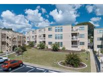 Attractive condo complex featuring well-maintained landscaping and multiple units with private balconies at 9661 Shore Dr. # B-22, Myrtle Beach, SC 29572