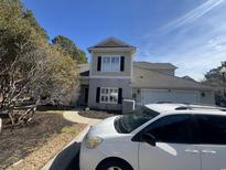 Charming home with a two-car garage and manicured front yard at 2450 Marsh Glen Dr. # 611, North Myrtle Beach, SC 29582