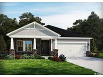 Charming single-story home featuring stone accents, a two-car garage, and a well-maintained lawn at 4307 Falls Oaks St., Myrtle Beach, SC 29579