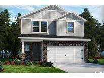 Charming two-story home with stone accents, gray siding, white garage doors and manicured lawn at 5001 Riverton Ct, Myrtle Beach, SC 29579