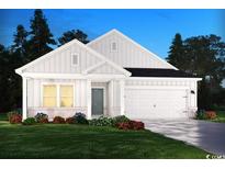 Charming one-story home with white siding, a two-car garage, and a well-manicured lawn at 5015 Riverton Ct, Myrtle Beach, SC 29579