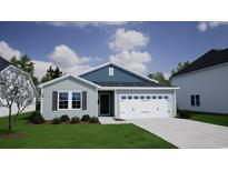 Charming single-Gathering home features a symmetrical facade, inviting curb appeal, and a two-car garage at 915 Agostino Dr., Myrtle Beach, SC 29579