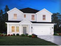 Charming two-story home featuring a welcoming front porch and a two-car garage at 2044 Copper Creek Ct., Longs, SC 29568