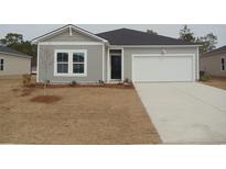 Charming single-story home with a well-manicured lawn and attached one car garage at 252 Warner Crossing Way, Loris, SC 29569