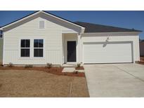 Charming single-Gathering home featuring vinyl siding and a two-car garage at 260 Warner Crossing Way, Loris, SC 29569