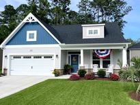 Charming single-Gathering home showcasing meticulous landscaping and a welcoming front porch at 378 Dunbarton Ln., Conway, SC 29526