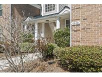 Charming home exterior featuring a cozy columned entrance and well-maintained landscaping at 4448 Lady Banks Ln. # 11E, Murrells Inlet, SC 29576
