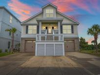 Charming home with a two-car garage and a cozy porch, perfect for enjoying evening sunsets at 489 Harbour View Dr., Myrtle Beach, SC 29579