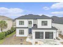 Striking two-story home with a three car garage and modern architectural details at 1217 Bentcreek Ln., Myrtle Beach, SC 29579