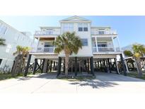 Beautiful stilted beach house with covered parking and multiple decks for enjoying coastal breezes and ocean views at 225-B Dogwood Dr. N, Murrells Inlet, SC 29576