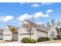 Charming home with a manicured front yard, attached garage and neutral color palette at 6013 Tramonto St., Myrtle Beach, SC 29577
