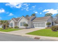 Charming single-story home with well-maintained landscaping and attached two-car garage at 619 Crestview Ct., Longs, SC 29568