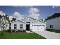 Charming single-story home with stone accents, a well-manicured lawn, and a two-car garage at 899 Agostino Dr., Myrtle Beach, SC 29579