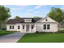 Charming home featuring board and batten siding, inviting front porch with chairs, and well-manicured lawn at 1110 N Middleton Dr. Nw, Calabash, NC 28467