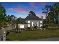 Beautiful gray home featuring lush landscaping and a well manicured front lawn at 3700 Waterford Dr., Myrtle Beach, SC 29577
