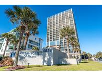 Ocean Forest Plaza with beautiful landscaping and a clear, sunny sky at 5523 North Ocean Blvd. # 1912, Myrtle Beach, SC 29577
