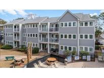 Beautiful building with multiple balconies and access to a community pool, creating an inviting outdoor space at 5905 South Kings Hwy. # 4219-D, Myrtle Beach, SC 29575