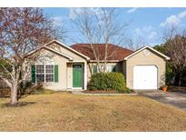 Charming single-story home with green shutters and a well-maintained front lawn at 6006 Quinn Rd., Myrtle Beach, SC 29579