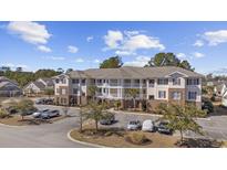 Spacious multi-Gathering building with outdoor balconies and ample parking in a well-maintained community at 730 Pickering Dr. # 201, Murrells Inlet, SC 29576