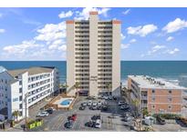 Oceanfront condo building with swimming pool and parking at 912 N Waccamaw Dr. # 1404, Garden City Beach, SC 29576