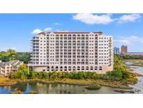 Stunning condominium building boasting multiple floors and a scenic waterfront view at 9547 Edgerton Dr. # 301, Myrtle Beach, SC 29572