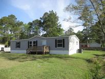 Charming single-story home features a well-maintained yard and a cozy front porch at 2016 Misty Morning Dr., Conway, SC 29527