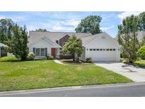 Charming single-Gathering home with a well-manicured lawn and attached two-car garage at 278 Tibton Circle, Myrtle Beach, SC 29588
