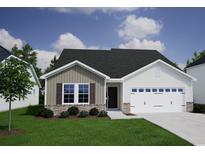 Charming single-story home with stone accents, a two-car garage, and a well-maintained lawn at 312 Mayflower Dr., Calabash, NC 28467