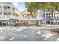 Charming beach home featuring a spacious balcony and ample ground-level parking at 6001 - T33 South Kings Hwy., Myrtle Beach, SC 29575